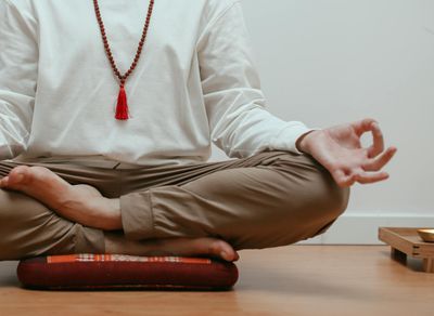 Close-up of hands in a meditative mudra position.